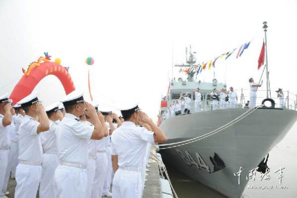 Chinese sailors salute as the HESHAN is placed in service on Oct. 10. (China Military Online)