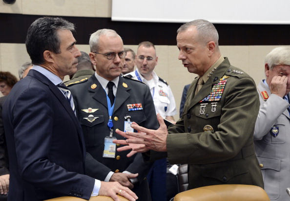 NATO Secretary General Anders Fogh Rasmussen (L) listens to then-ISAF Commander US General John Allen (R) prior to the start of a NATO Defence Ministers meeting at the NATO headquarters in Brussels in October 2012. (AFP PHOTO/Thierry Charlier via Getty Images)