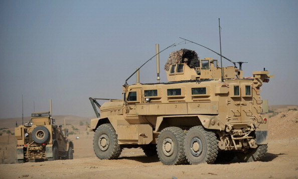 MRAP (Mine Resistant Ambush Protected) vehicles operated by US Marines from 1st Battalion 7th Marines Regiment leave PB Fulod in Sangin, Afghanistan in June 2012. (ADEK BERRY/AFP/GettyImages)