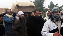 The coffin of a man killed in fighing is carried for burial in the western Iraqi city of Fallujah, Iraq, on Saturday. The Obama administration says it will not insert US troops to help take back the city. (AFP/Getty Images)