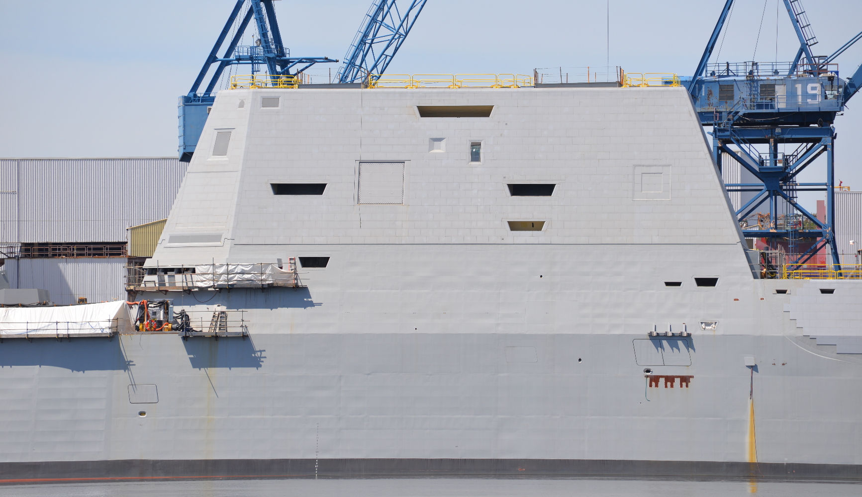 Closeup view of the Zumwalt's superstructure. The deckhouse above the bridge windows is a composite-material structure, built at Gulfport, Mississippi by Ingalls Shipbuilding and barged north to be installed in Maine. A similar structure is being built for the Michael Monsoor, but the Lyndon B. Johnson will have a steel structure built at Bath. 