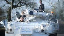 Nick Mead, the owner of Tanks A Lot, in the UK, drives his sons to school in one of the company's 120 tanks.